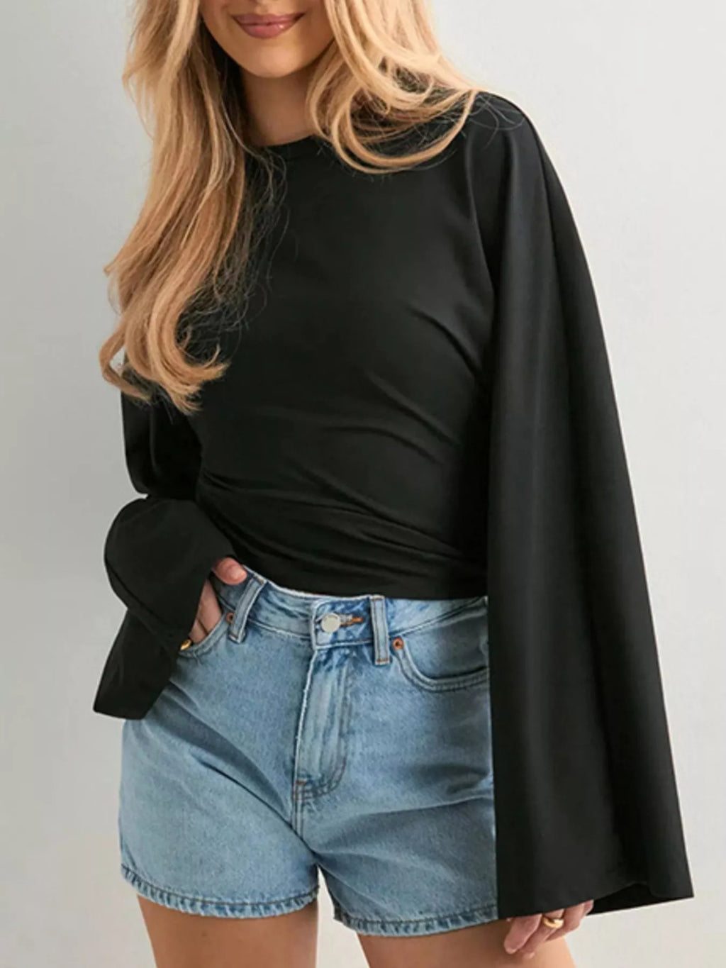 Black long-sleeve fitted t-shirt with crew neck and wide flared sleeves