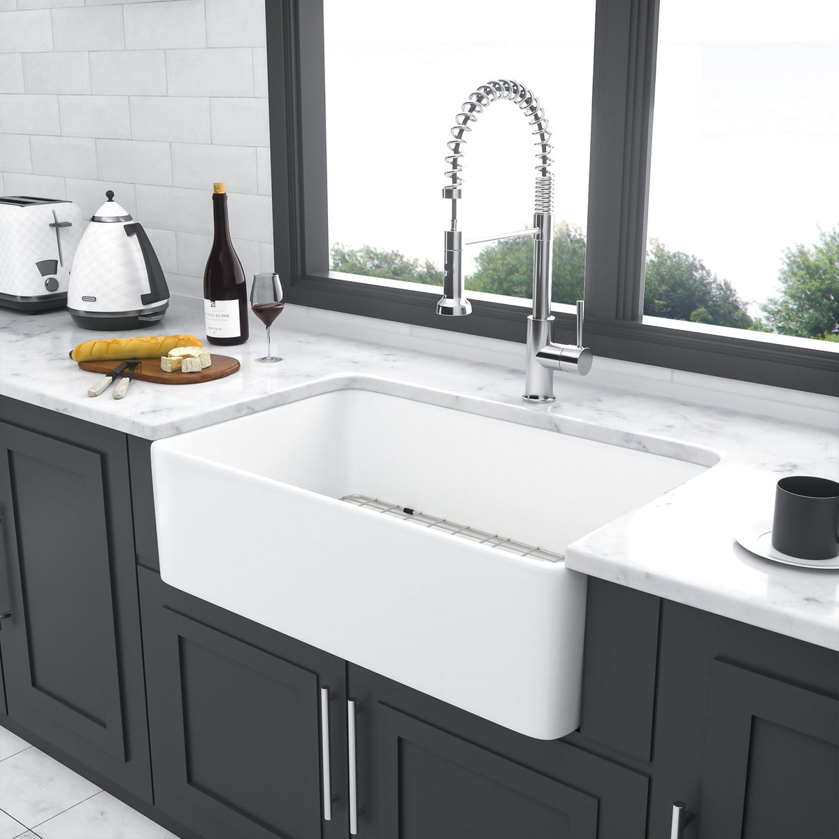 White ceramic single-bowl farmhouse apron front sink with smooth basin and drain opening