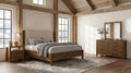 Warm brown Eastern king bed with upholstered headboard, gray bedding and throw