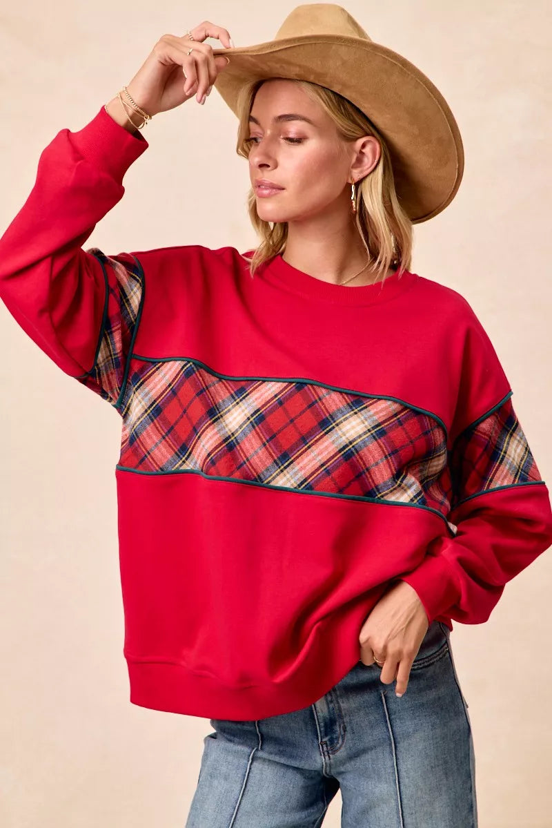 Red plaid block sweatshirt with teal binding across chest, long sleeves, crew neck