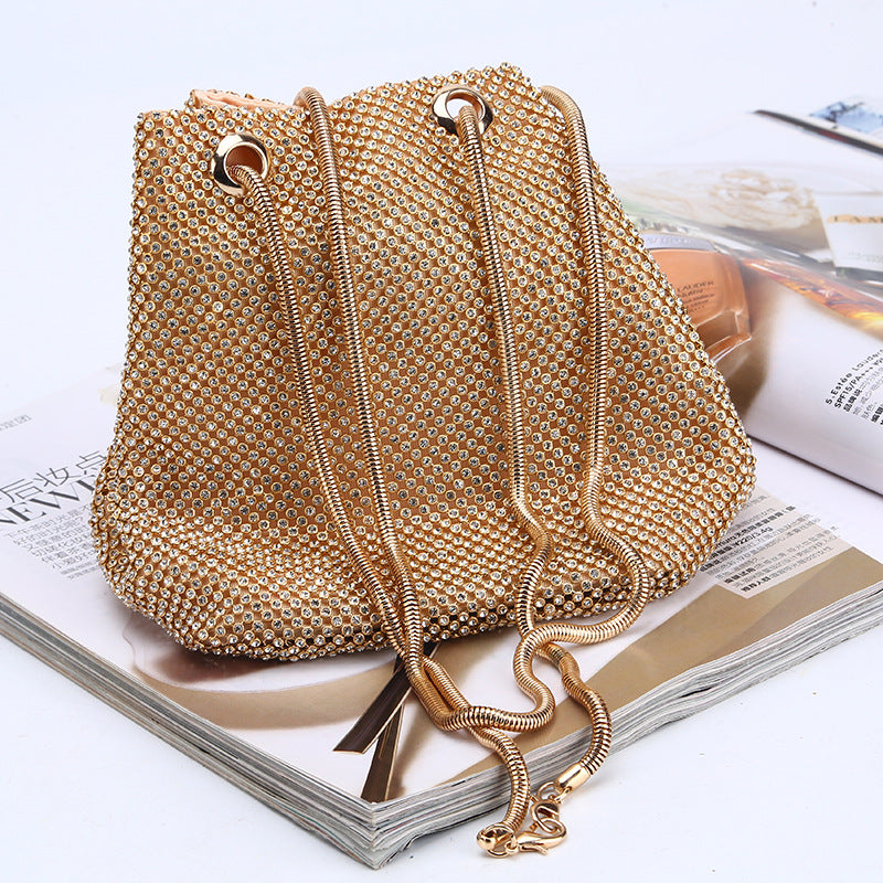 Gold crystal beaded crossbody bag with double handles and tassel pull