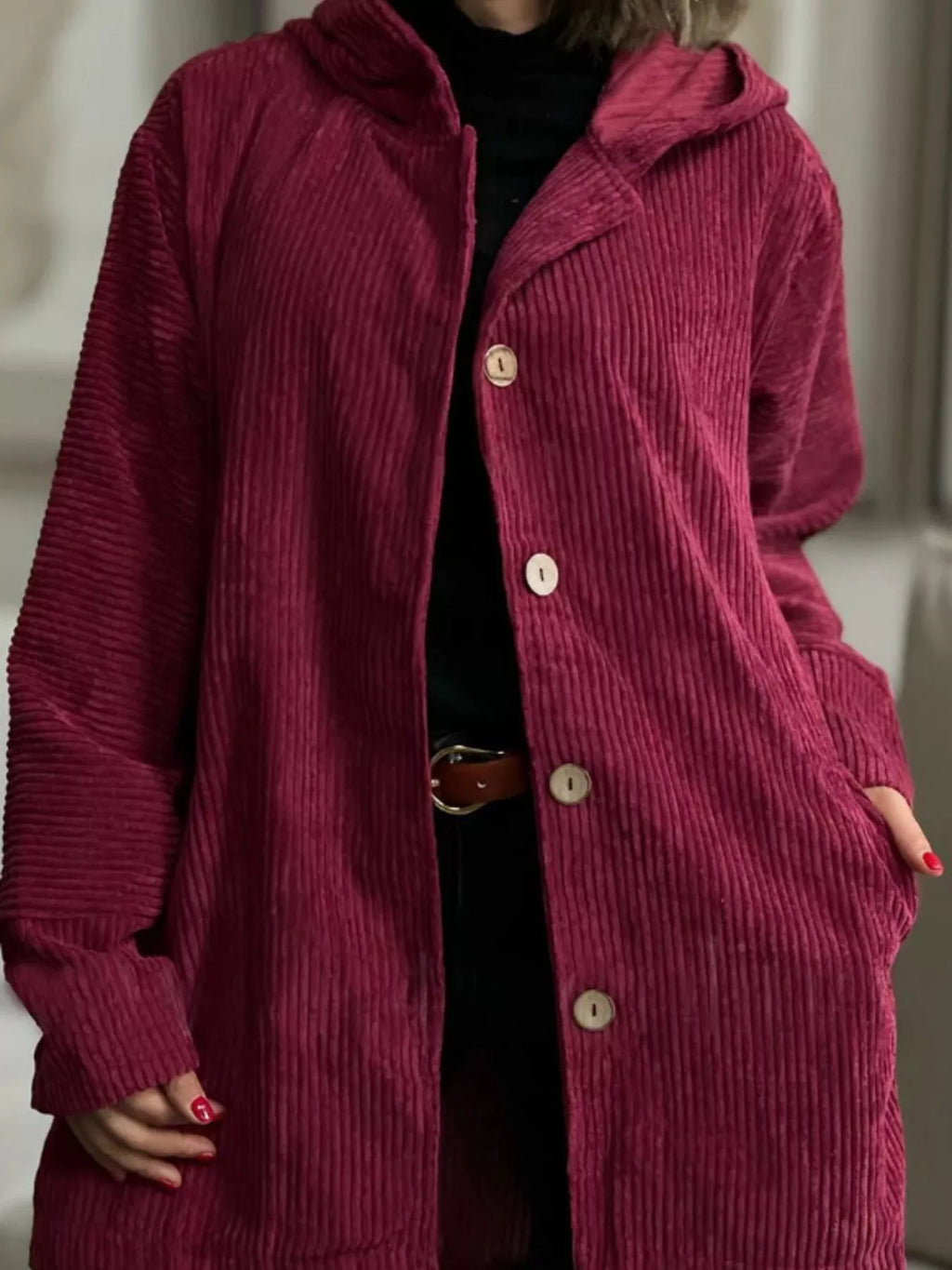 Burgundy corduroy hooded button-up jacket with front button placket and long sleeves