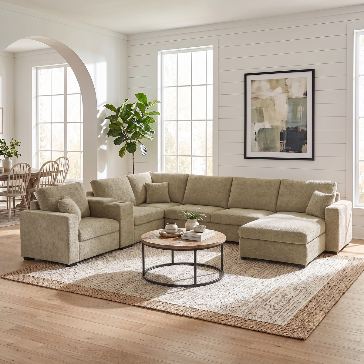 Beige modular sectional sofa with chaise, corner armrests, and plush seat cushions