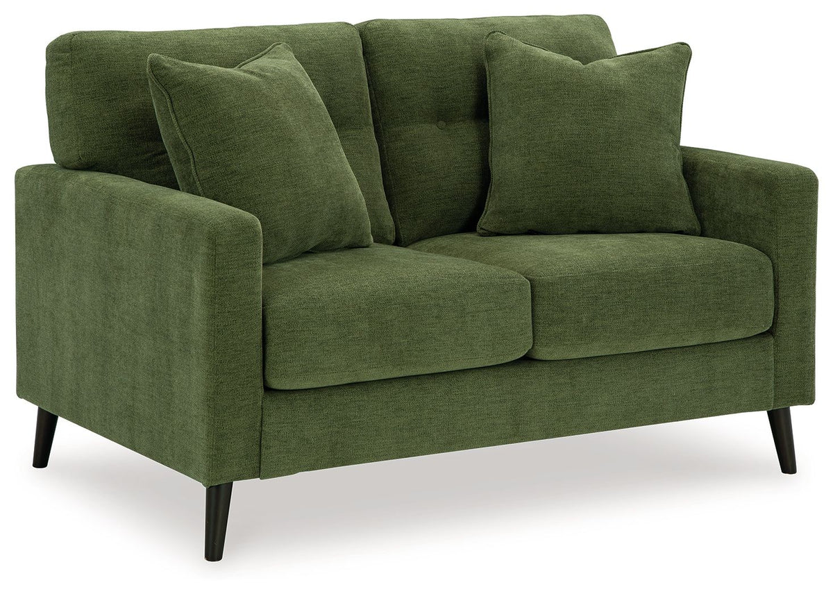 Green fabric sofa with rounded arms, plush back cushions, and tapered wooden legs