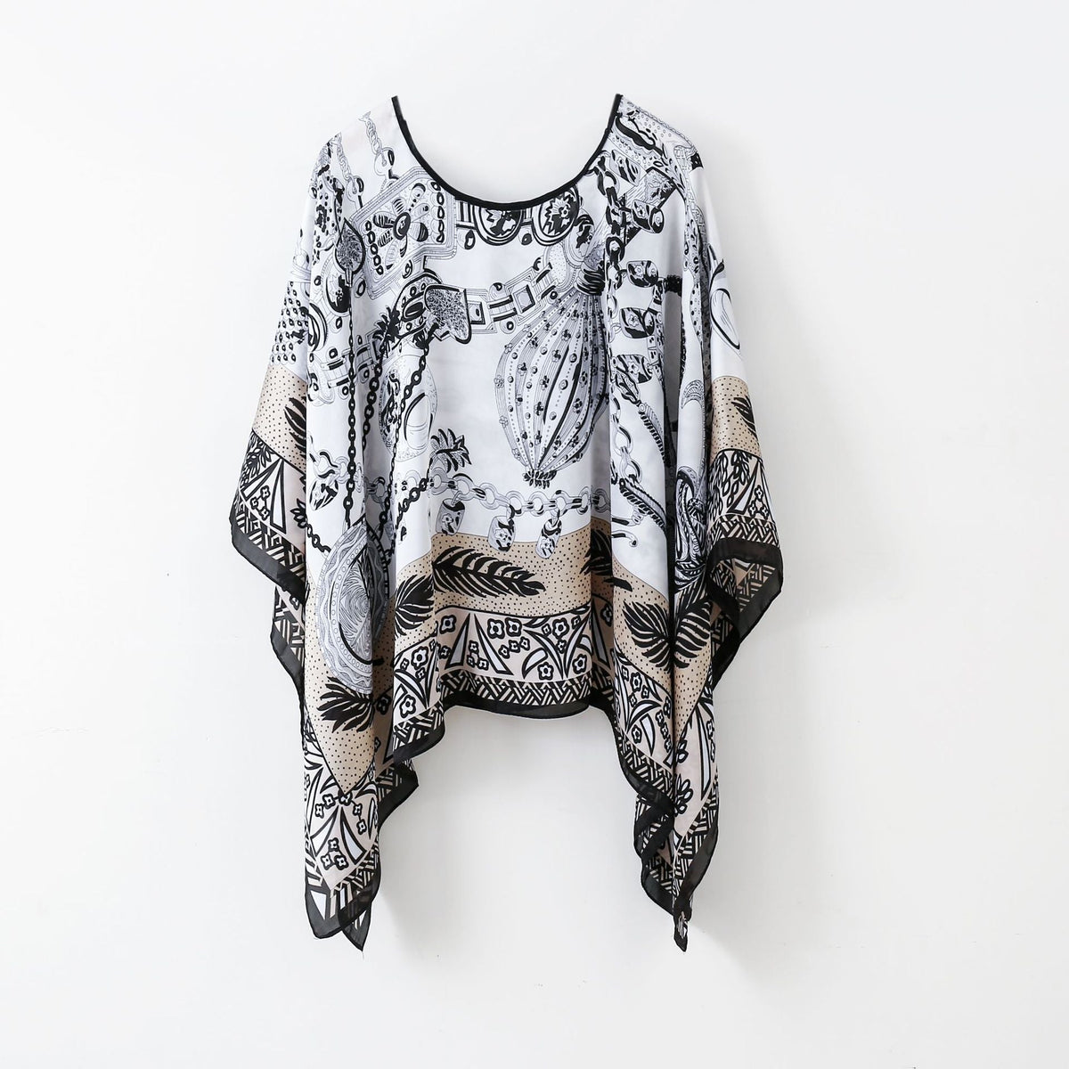 Black-and-white chain print poncho shawl with fringe hem and round neckline