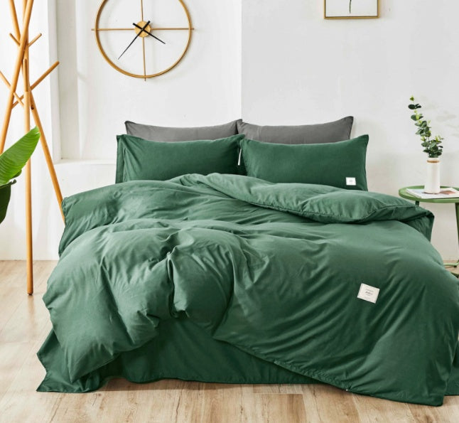 Dark green bedding set with matching pillowcases and duvet cover