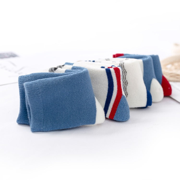 Children's terry socks, solid blue and striped designs in a folded pair