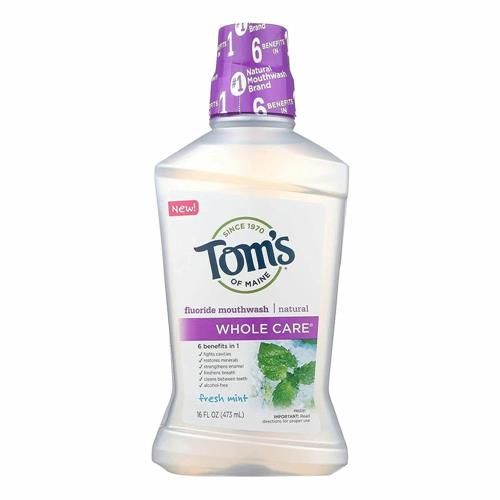 Toms of Maine Whole Care fresh mint natural mouthwash bottle with purple cap