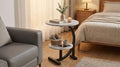 Light round side table with two-tier storage and black metal frame.