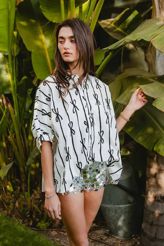 Off-white and black printed button-down shirt with short sleeves and button front