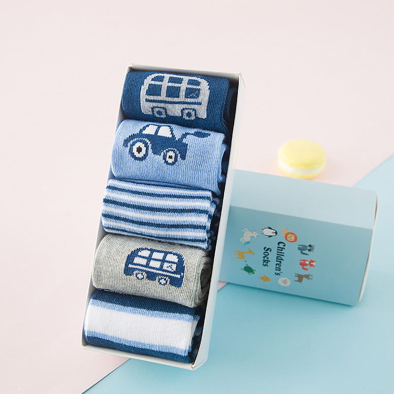 Pack of baby socks showing blue car, gray pair, and striped designs