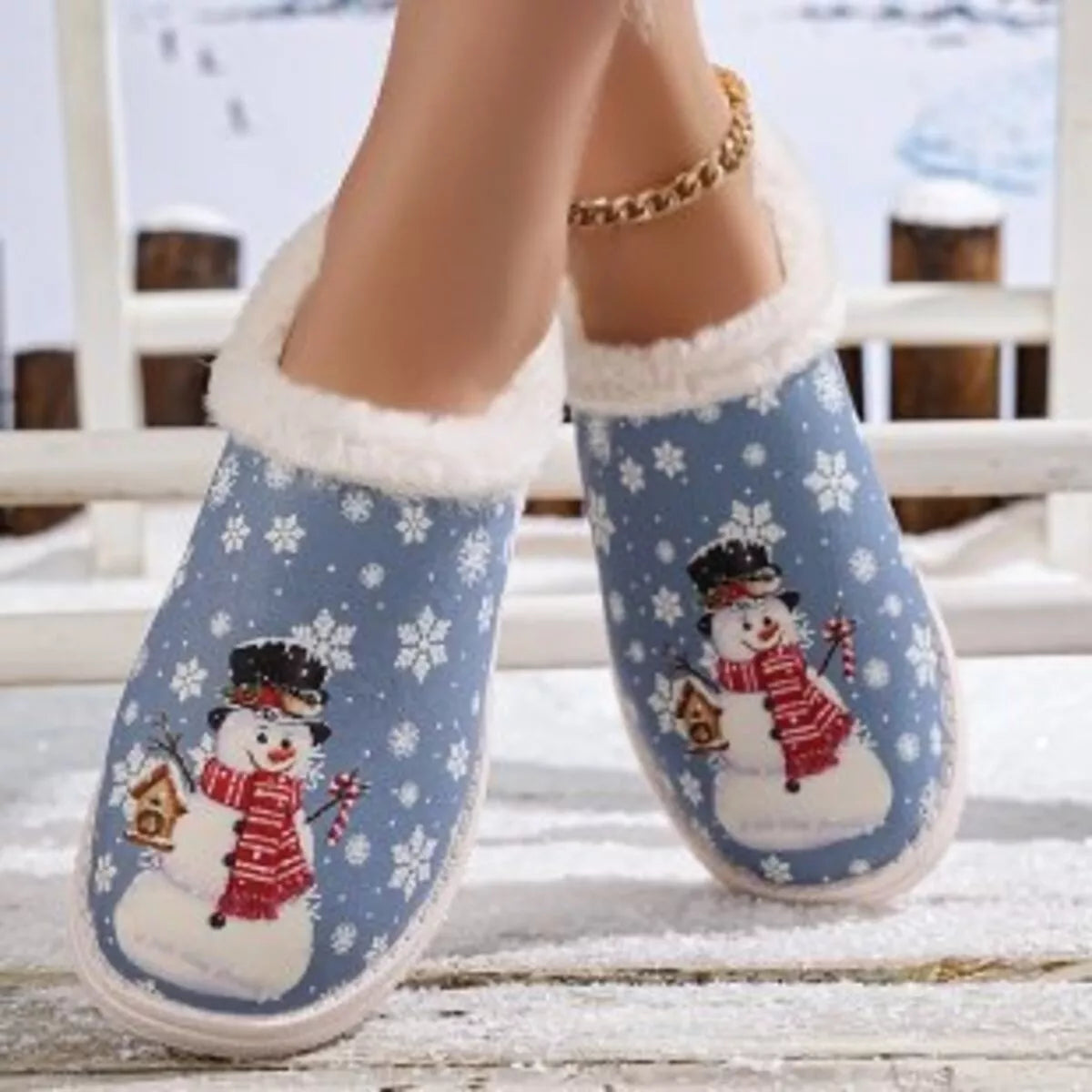 Blue Christmas snowman plush slippers with soft white fur trim at the opening