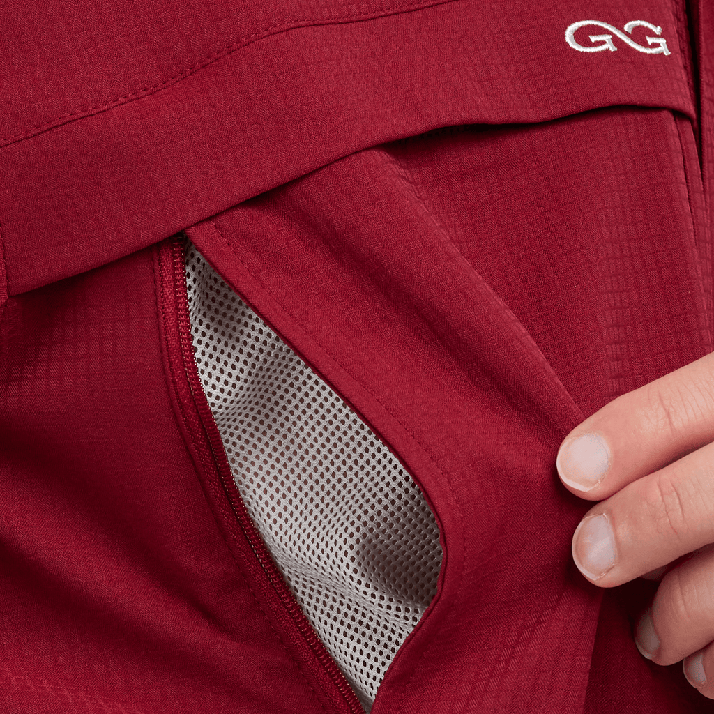 Oxblood scout shirt side opening with mesh insert and curved seam detail