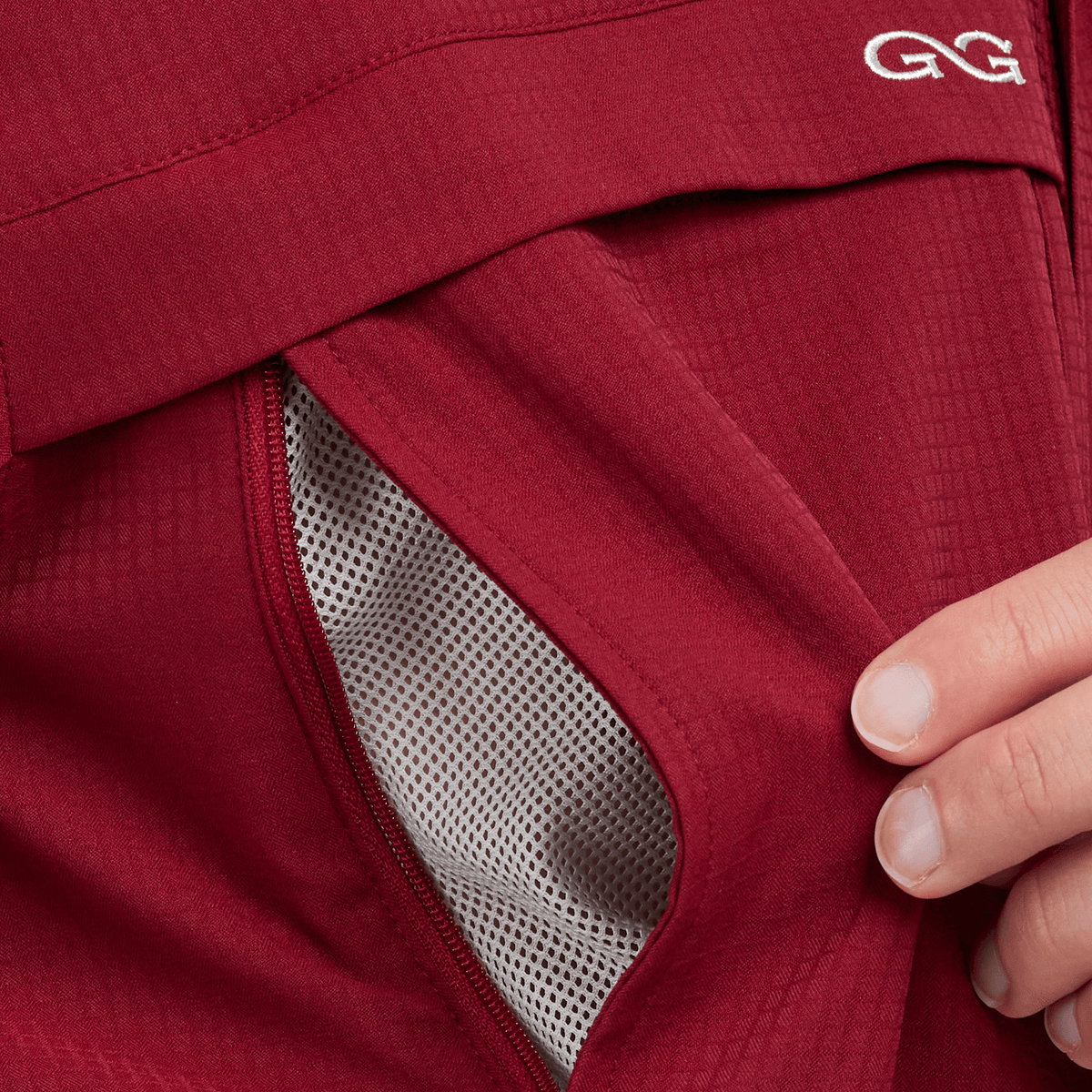 Oxblood scout shirt side opening with mesh insert and curved seam detail
