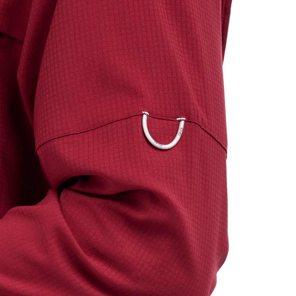 Oxblood long-sleeve scout shirt cuff with small metal loop and textured fabric