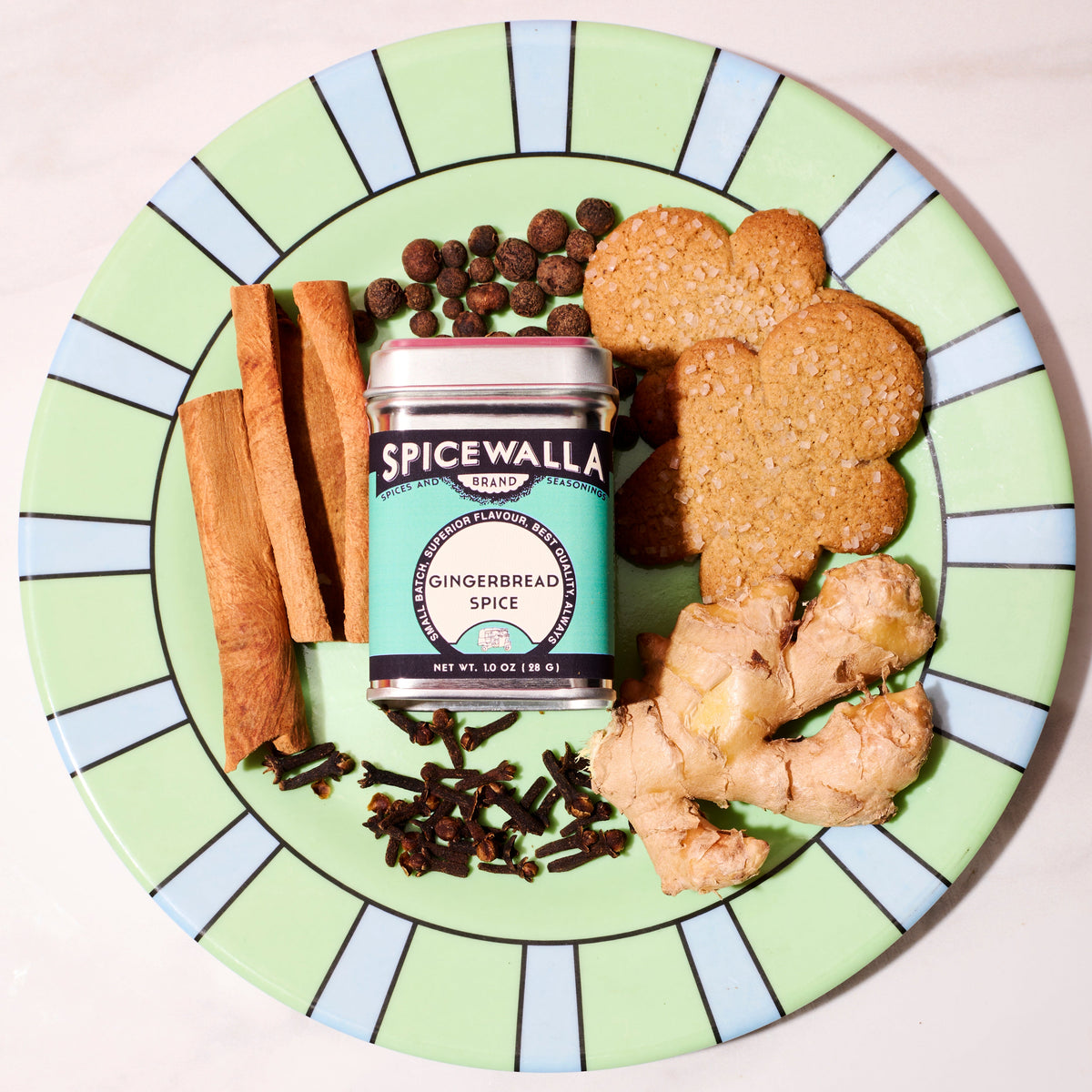 Gingerbread spice blend tin with cinnamon cookie pieces and dark spice granules