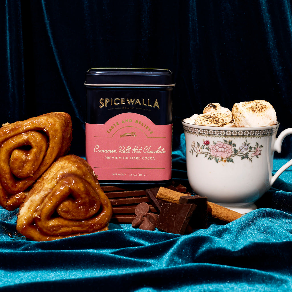 Cinnamon Roll hot chocolate tin with cinnamon rolls, chocolates, and marshmallows