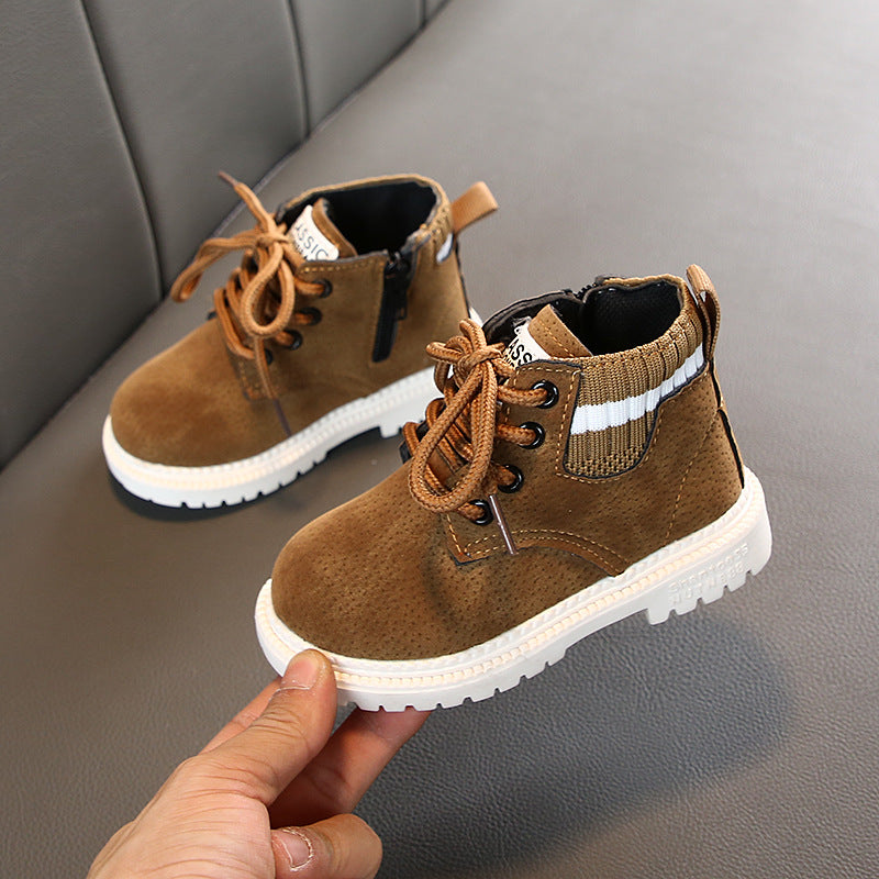 Brown lace-up ankle boots with white striped collar and white rugged sole