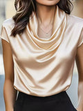 Beige satin cowl neck blouse with short sleeves and draped cowl neckline.