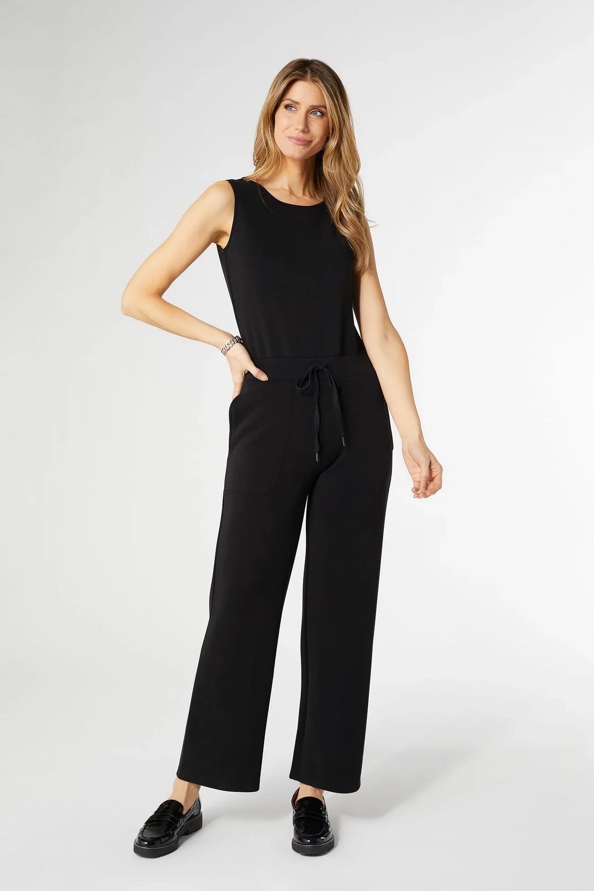 Black sleeveless wide-leg romper with drawstring waist and side pockets