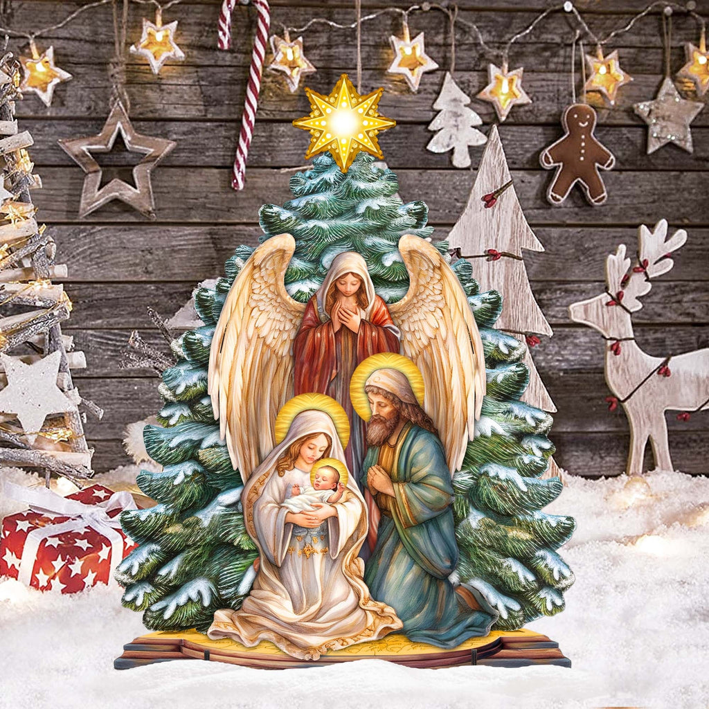 Nativity yard decoration with glowing star above angel, Mary holding baby, and Joseph in snow