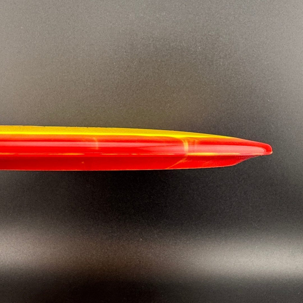 Orange-red disc golf driver side profile