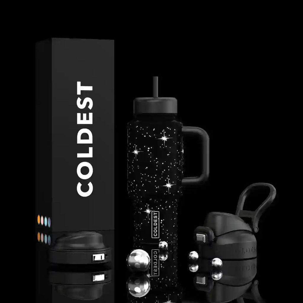 Black star-speckled insulated bottle with flip straw lid and carry handle