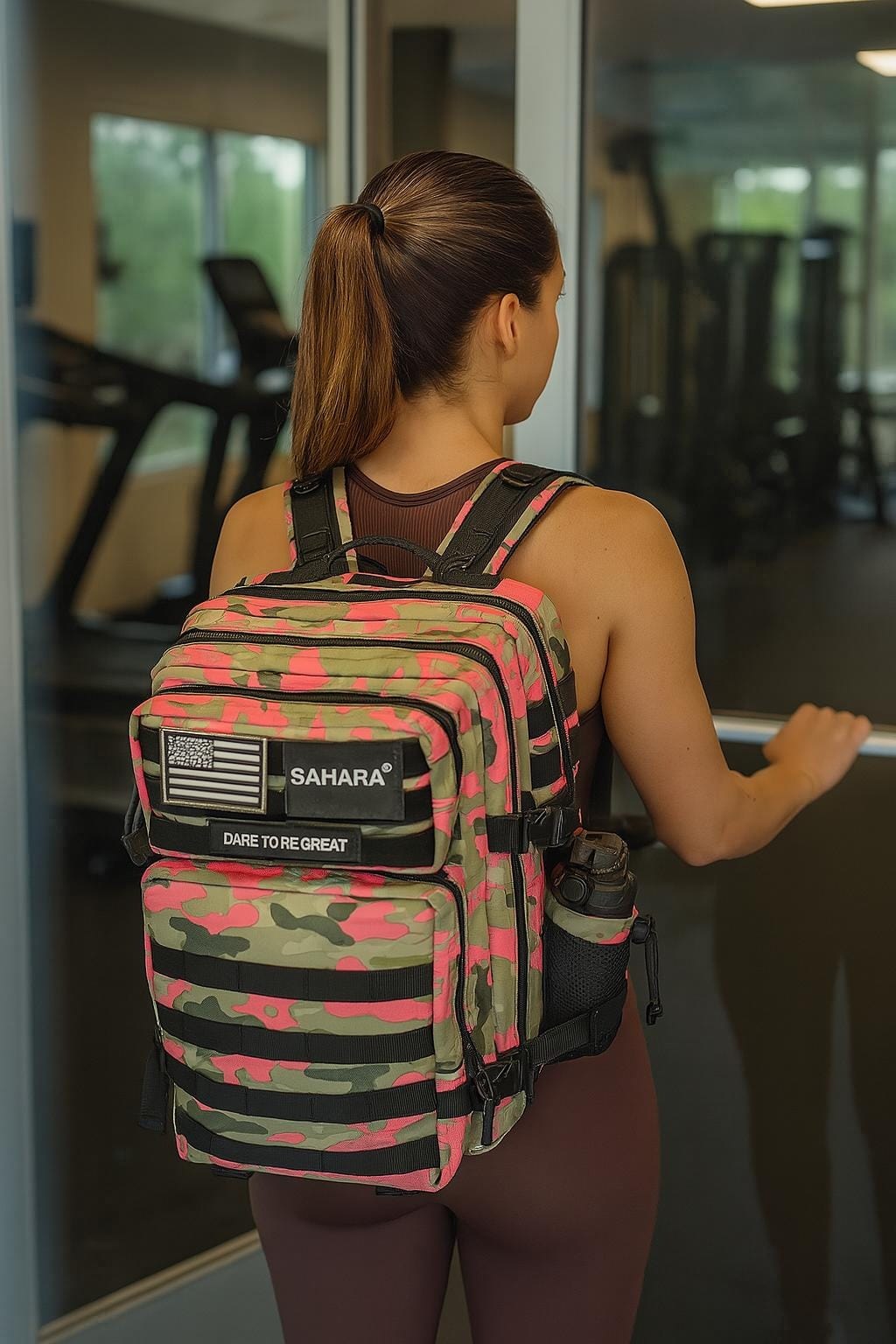 Pink and green camo travel laptop backpack with padded shoulder straps and back panel