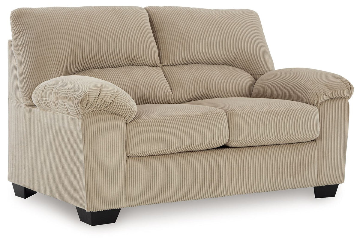 Beige recliner chair with ribbed upholstery and padded armrests