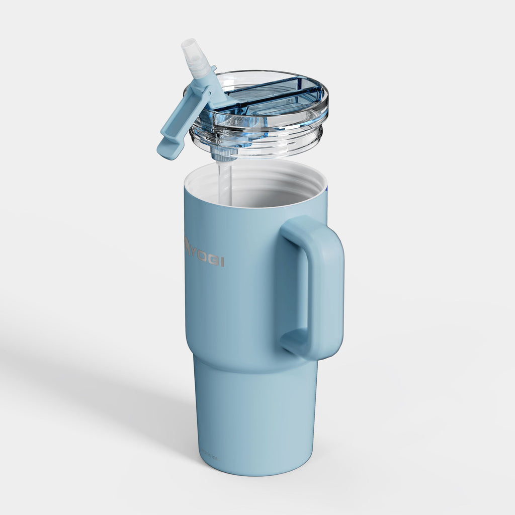 Light blue ceramic-lined evolution tumbler with flip straw lid and side handle.