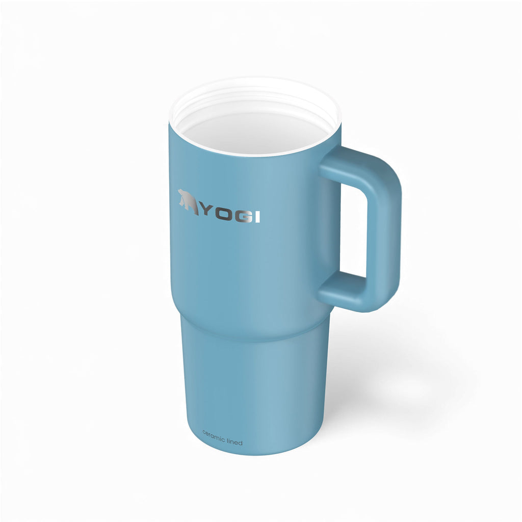 Ceramic-lined evolution tumbler in teal blue with open white lid and side handle