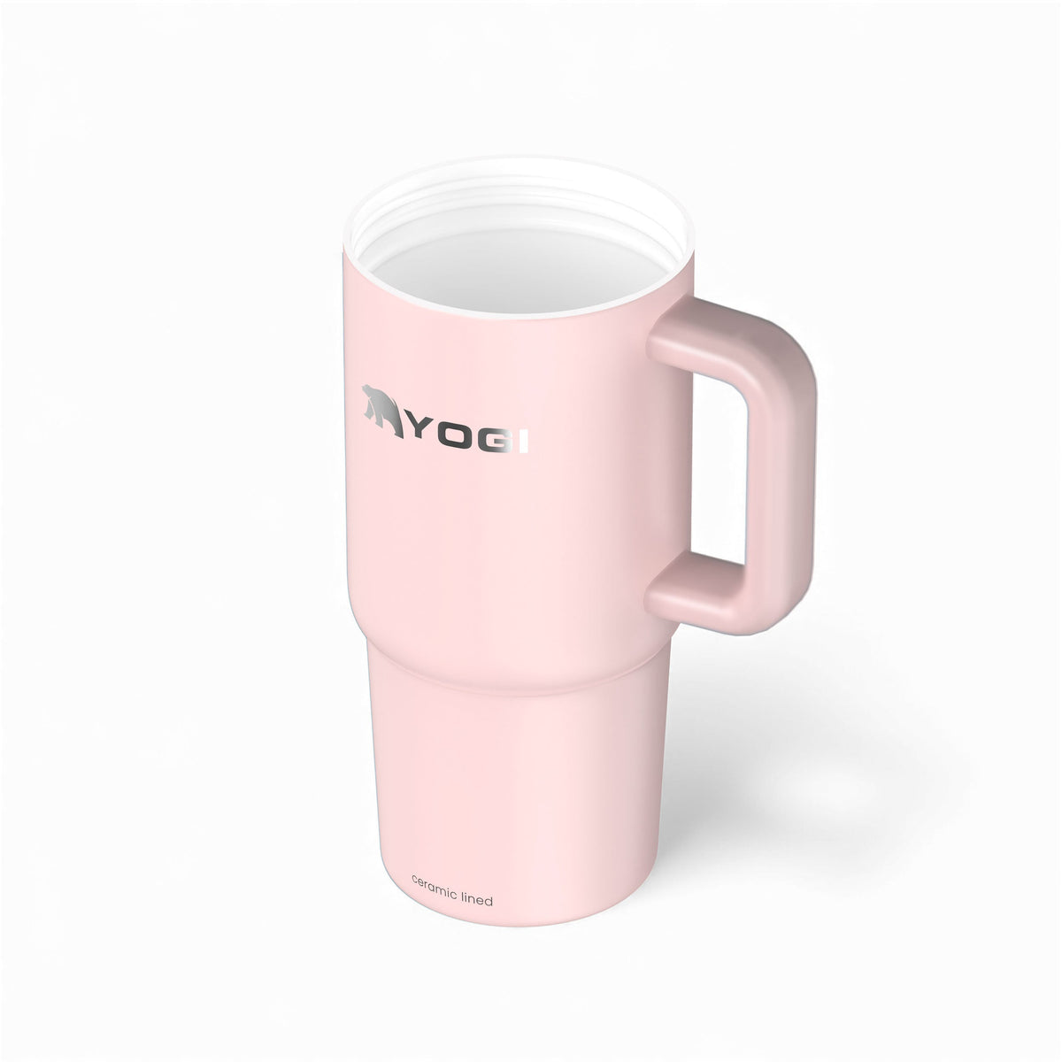 Ceramic-lined tumbler in pale pink with side handle and white interior rim.
