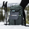 8W solar panel in dark case attached to a hiking backpack