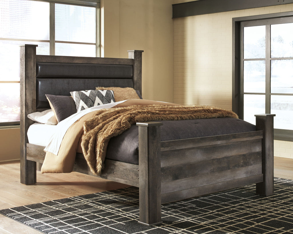 Gray wood bed frame with dark upholstered headboard and side rails