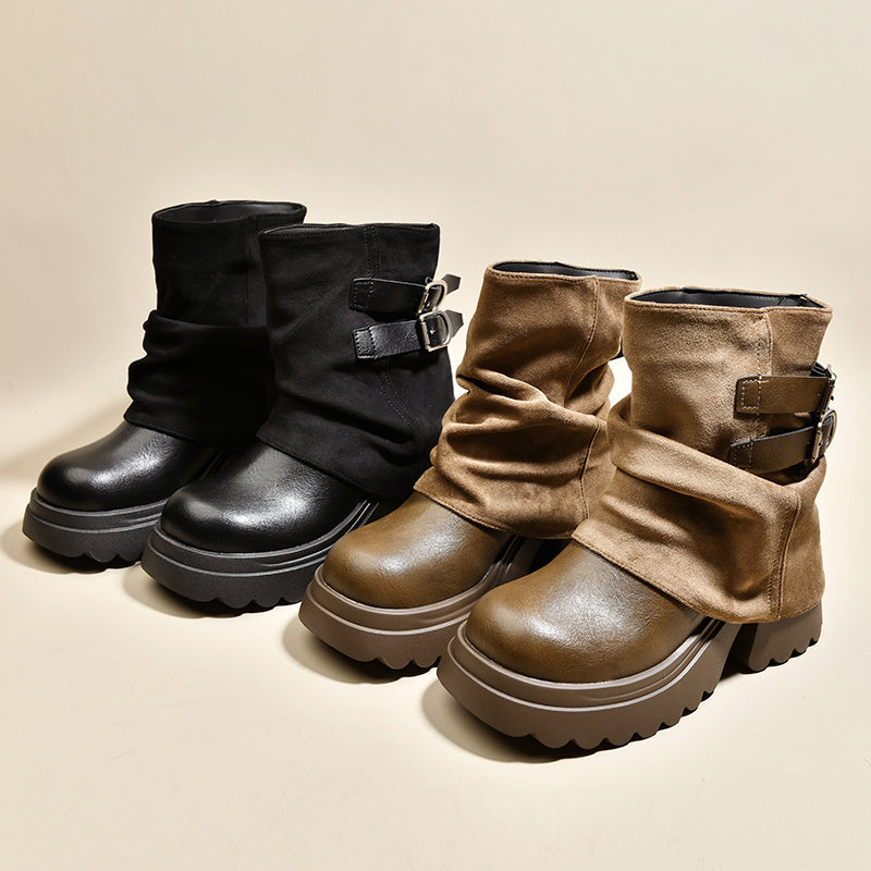 Pair of black and khaki platform combat ankle boots with buckled straps and chunky soles.