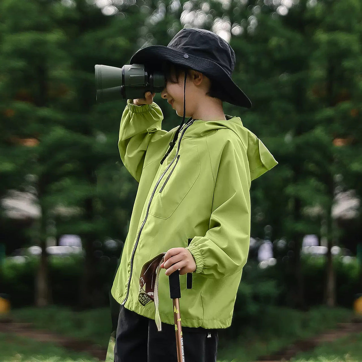 Green hooded windproof outdoor jacket with full front zipper and adjustable hem