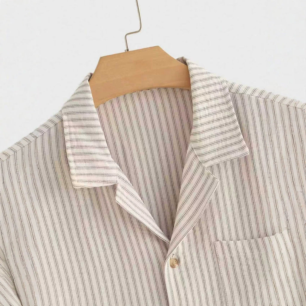 Beige striped short-sleeve shirt back yoke and collar on hanger