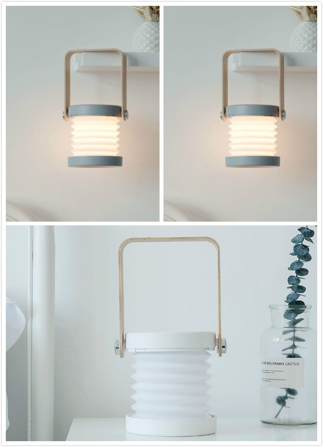 Foldable LED night light lantern with tan handle, ribbed white shade, blue base ring