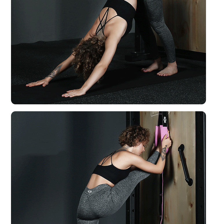 Pink yoga stretch band in use with fabric loops for stretching on rig