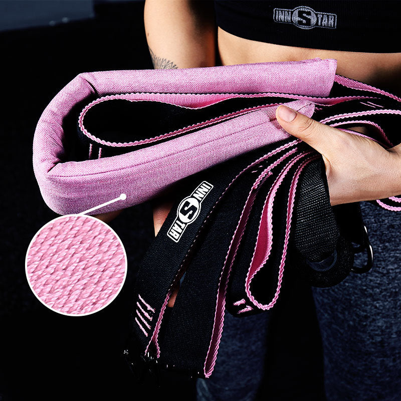 Pink and black yoga stretch band with braided cords and stitched texture