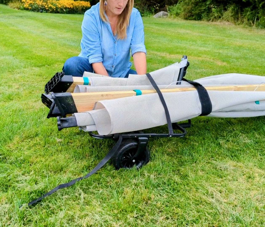 Lawn roller drum with straps and black wheel base