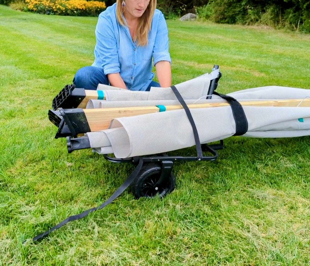 Lawn roller drum with straps and black wheel base