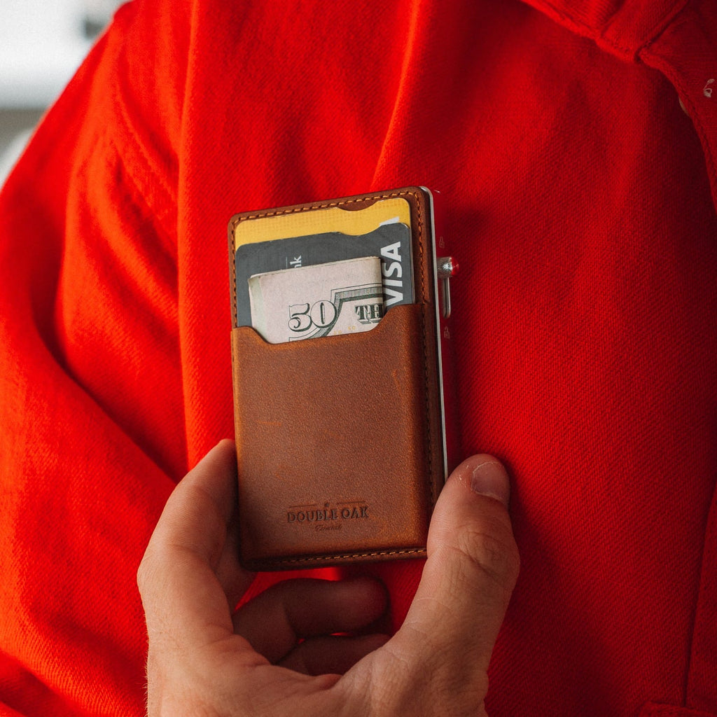 Tan leather card mod wallet with cards visible and gold-tone frame