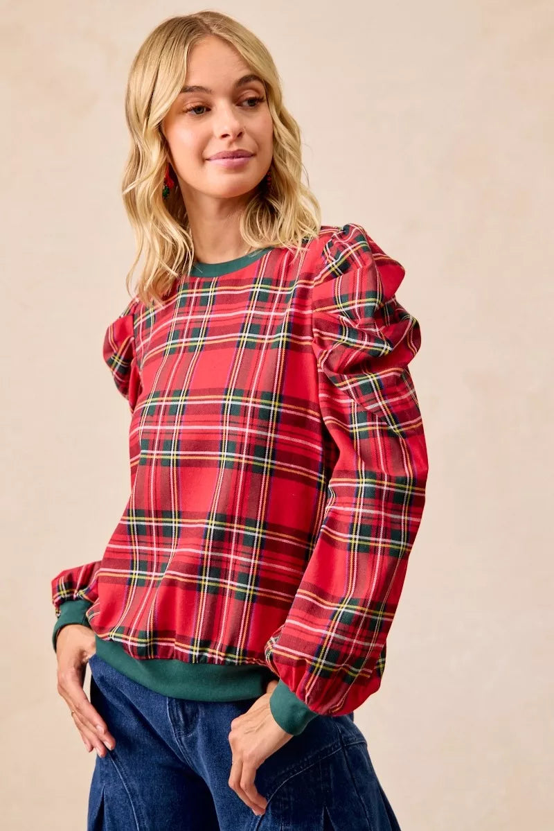 Red plaid top with exaggerated shoulder sleeves and long puff sleeves, green crew neck