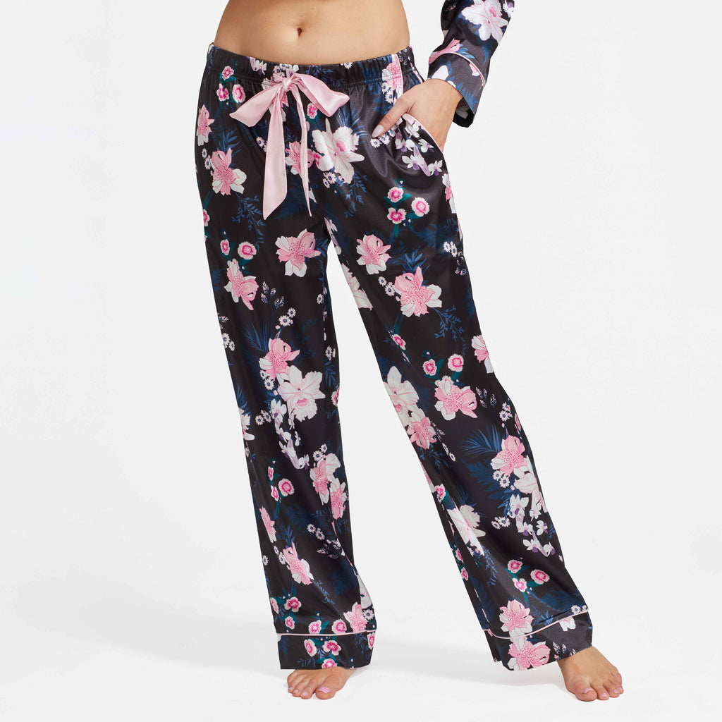 Black floral satin pajama pants with elastic waist and bow-tie