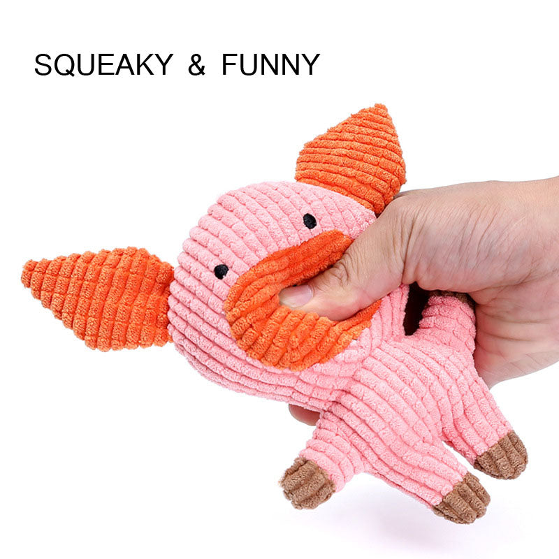 Orange and pink fish-shaped squeaky plush dog toy with brown feet