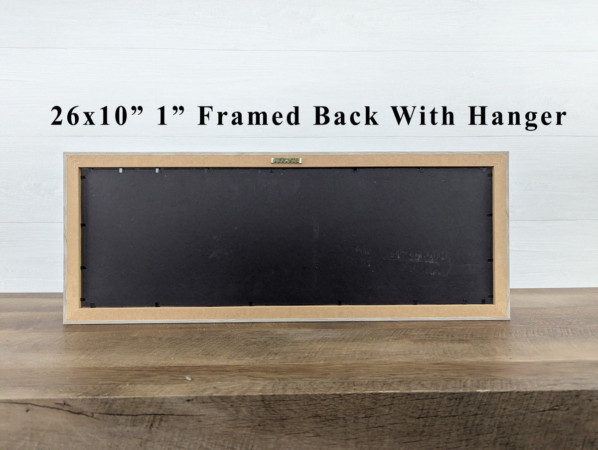 26x10" framed wall art back with hanger in light wood frame and dark backing