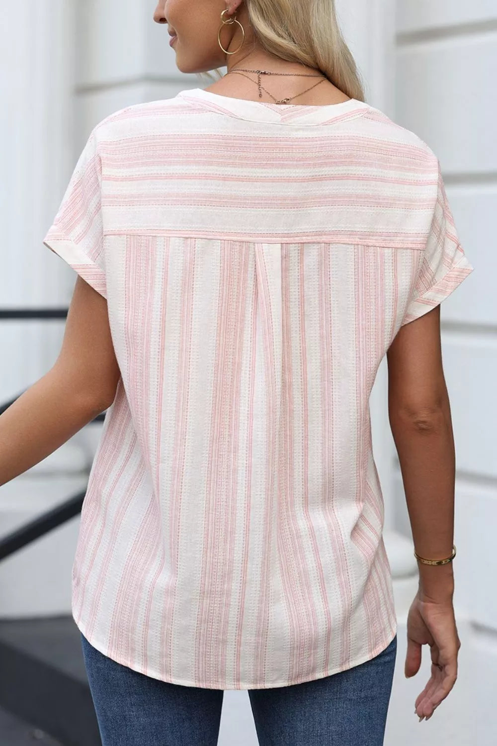 Dusty pink striped short-sleeve blouse, back view with yoke and pleat