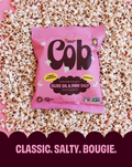 Cob popcorn snack bag, olive oil and pink salt flavor, pink pouch.