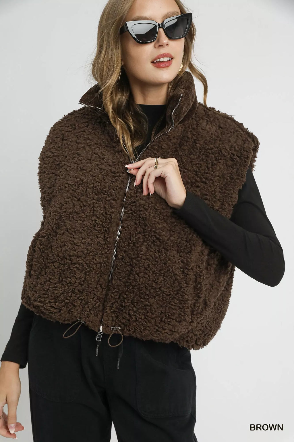 Brown sherpa-lined zip vest with drawstring hem, front zip and stand collar